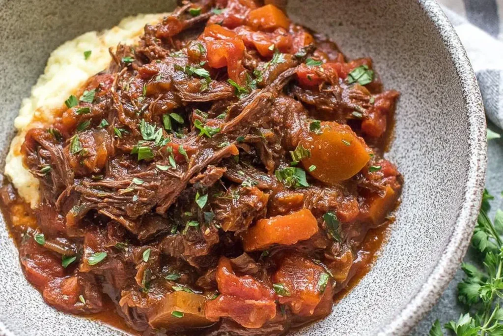 Slow Cooker Beef Ragu with tender vegetables served in a rustic bowl