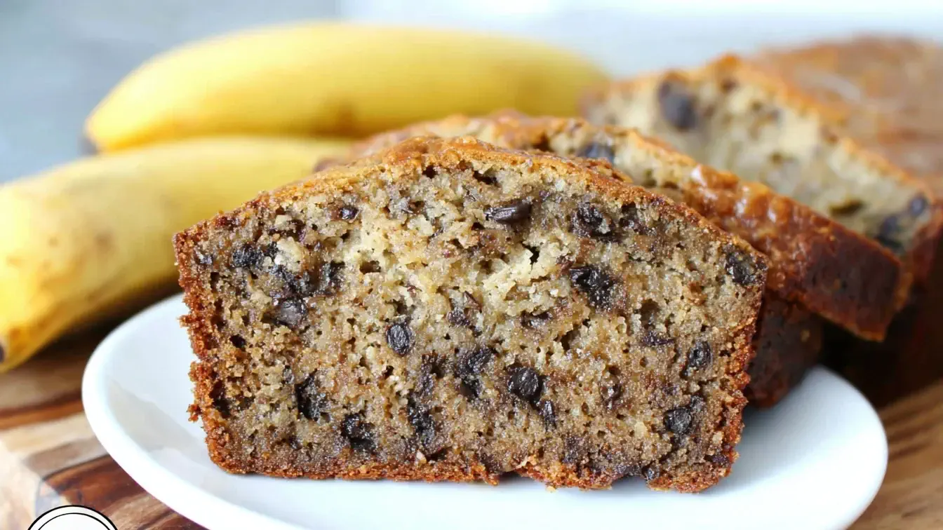 Sliced Crockpot Banana Bread with chocolate chips on a plate