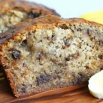 Moist Crockpot Banana Bread slice with chocolate chips and banana slices