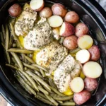 Crockpot Chicken Potatoes and Green Beans cooked with red potatoes and fresh green beans in a slow cooker.