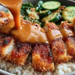 Golden chicken katsu topped with creamy tonkatsu sauce poured fresh in Japanese Katsu Bowls with Tonkatsu Sauce.