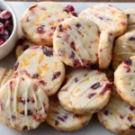Orange Cranberry Shortbread Cookies with white glaze and bright citrus zest