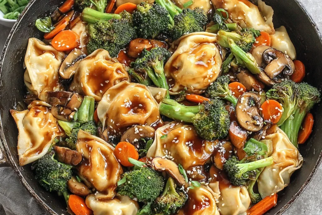 Potsticker Stir Fry with dumplings, broccoli, mushrooms, and carrots in a savory thick sauce