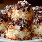 Plate of Easy No-Bake Moose Farts topped with chocolate drizzle, mini chocolate chips, and toasted coconut flakes.