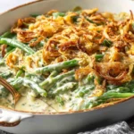 Campbells Green Bean Casserole baked in a casserole dish with creamy sauce and crispy onions.