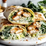 Chicken Caesar Wrap stacked with breaded chicken, romaine, parmesan, and Caesar dressing