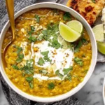Curry Lentil Soup served with lime wedges and naan bread