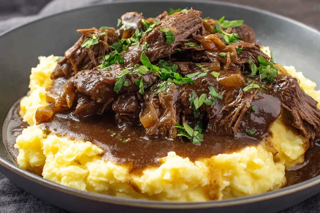 Hearty Comfort Slow Cooker Beef Manhattan topped with rich brown gravy over creamy mashed potatoes.