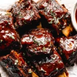 Slow Cooker Ribs glazed with rich barbecue sauce and finished until tender