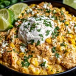 Slow Cooker Street Corn Chicken with creamy sauce, corn, cotija cheese, and fresh cilantro