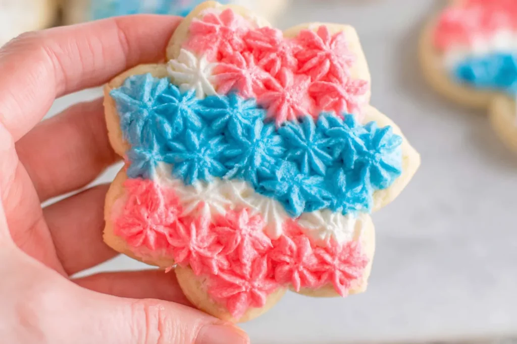 Soft Sugar Cookies decorated with red, white, and blue star-shaped frosting