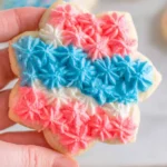 Soft Sugar Cookies decorated with red, white, and blue star-shaped frosting