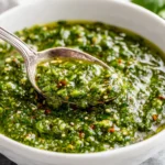 Zhoug Sauce made with fresh cilantro, jalapeños, garlic, and olive oil in a white bowl