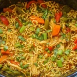 Crock Pot chicken Ramen packed with vegetables, tender chicken, and flavorful broth in a slow cooker