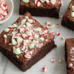 Peppermint Brownies with chocolate frosting and crushed candy cane topping.