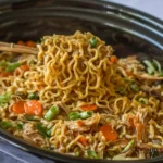 Crock Pot chicken Ramen with tender noodles, veggies, and shredded chicken served straight from a slow cooker