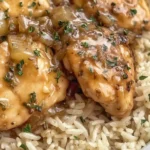 Creamy Crock Pot No Peek Chicken with Rice topped with savory onion gravy, served over fluffy jasmine rice for a cozy slow cooker dinner.