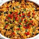 Chicken Burrito Casserole baked with shredded chicken, black beans, corn, and melted cheese in a white casserole dish