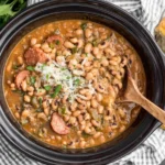Crock Pot Hoppin' John with black-eyed peas and smoked sausage served with cornbread