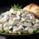 Dill Pickle Chicken Salad served on lettuce with crusty bread