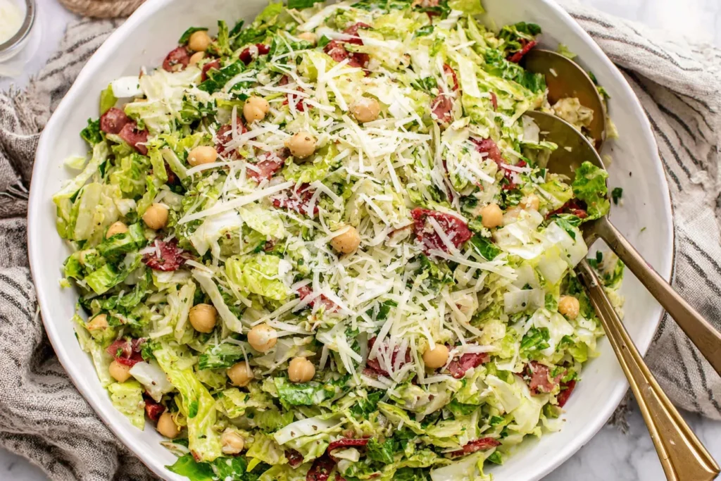 Famous La Scala Chopped Salad Recipe with crisp lettuce, salami, chickpeas, and grated cheese