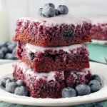 Glazed Blueberry Brownies with fresh blueberries and creamy glaze