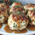 Turkey stuffing Balls topped with gravy on a festive serving platter