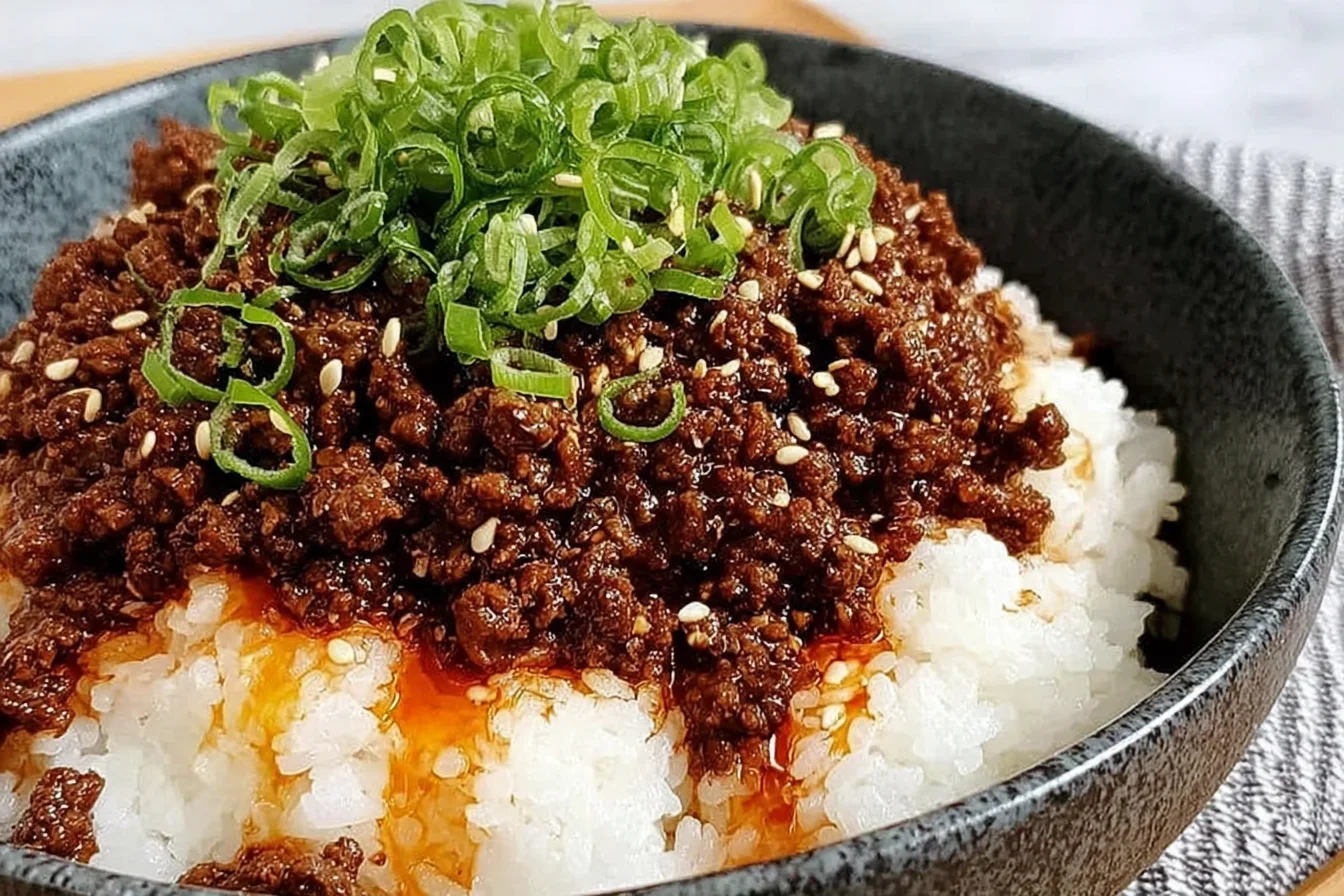 Ground Beef Hot Honey Bowl served over fluffy white rice, topped with green onions and sesame seeds, with a glossy sweet-spicy beef sauce.