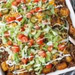 Big Mac Casserole with crispy potatoes, ground beef, pickles and creamy special sauce ready to serve
