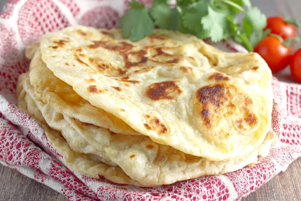 Chapati Flatbread served warm with fresh herbs and tomatoes
