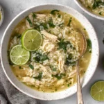 Ginger Lime Chicken and Rice Soup with jasmine rice, shredded chicken, and lime rounds