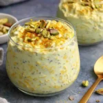 Indian Overnight Oats inspired by kulfi flavors with saffron, cardamom, and pistachios