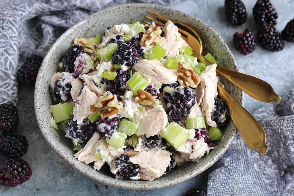 Low Carb Blackberry Cottage Cheese Chicken Salad in a rustic bowl with walnuts, celery, and blackberries