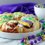 Easy King Cake Recipe – Cinnamon Roll King Cake with colorful Mardi Gras frosting drizzle