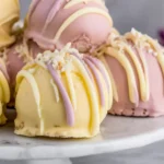 Banana Pudding Easter Truffles coated in pastel chocolate with drizzle and wafer crumbs