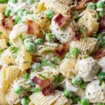 Close-up of Creamy Pasta Salad with rotini, bacon, peas, and creamy dressing