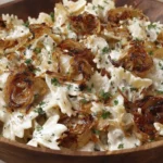 Close-up of French Onion Pasta Salad with caramelized onions and herbs