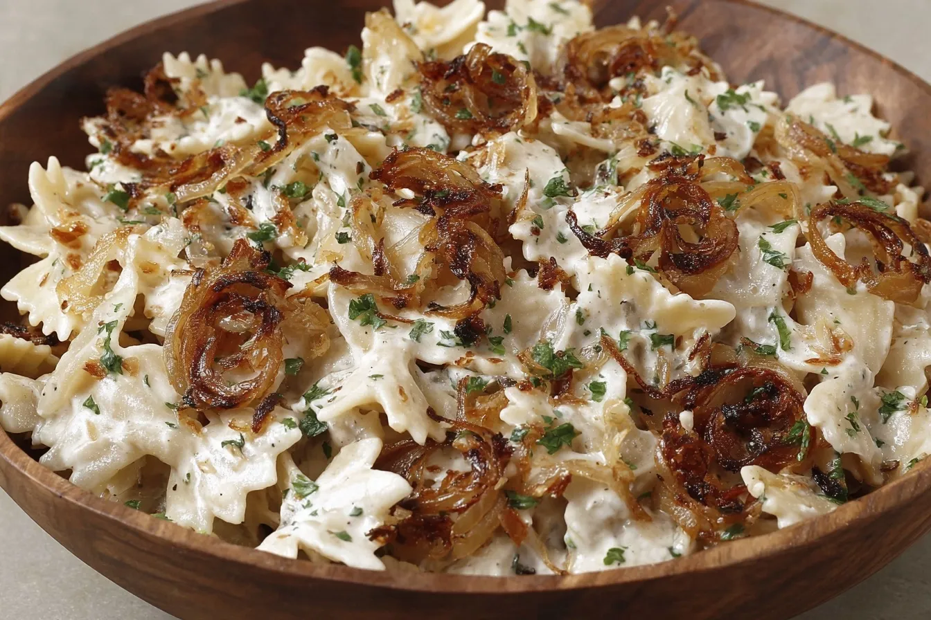 Close-up of French Onion Pasta Salad with caramelized onions and herbs