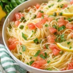 Lemon Capellini Salad Recipe served with lemon slices and fresh herbs