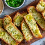 Cheesy Peperoncini Garlic Bread slices with melted cheese and peppers